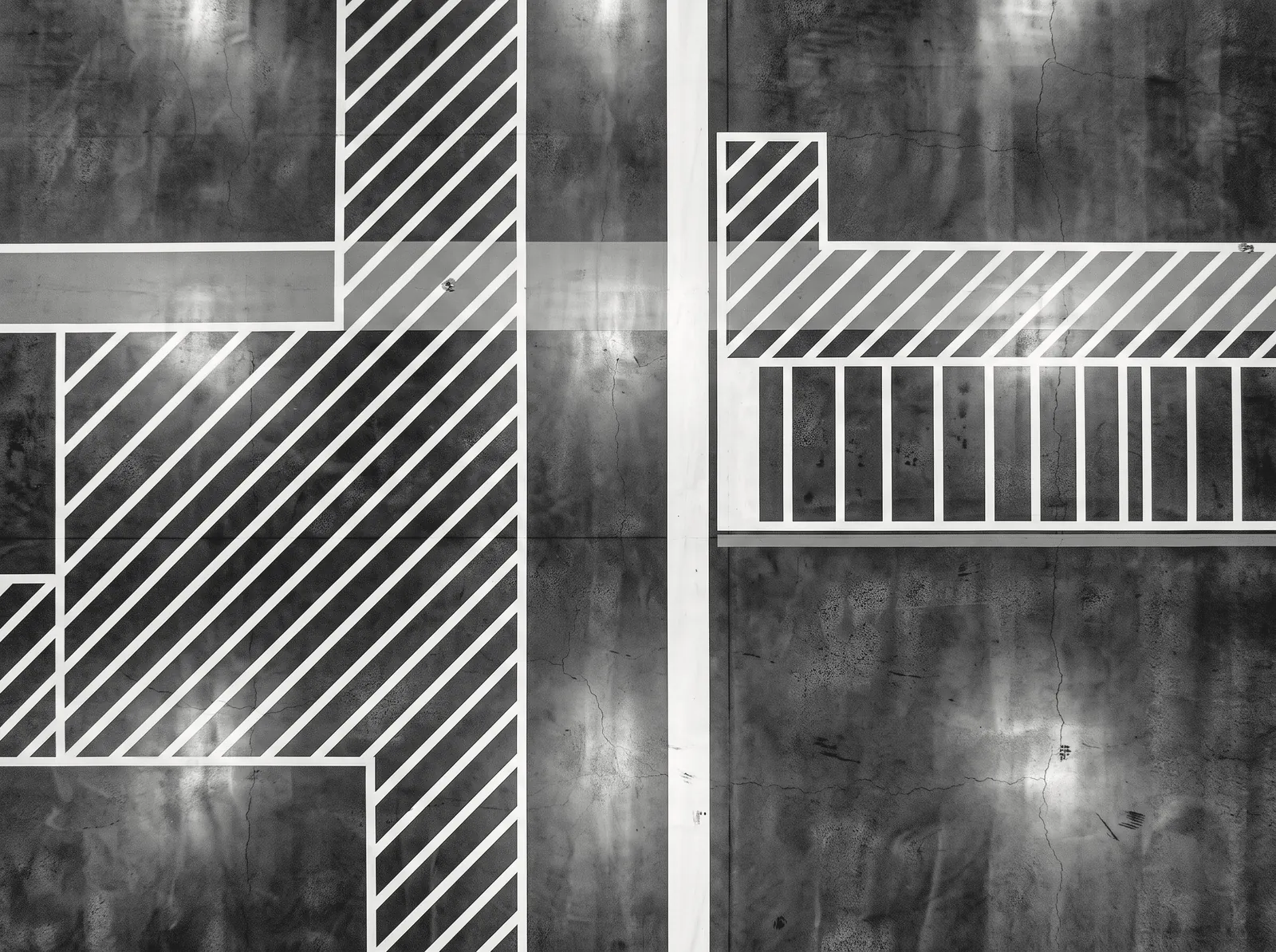 Painted lane markings on a polished factory floor